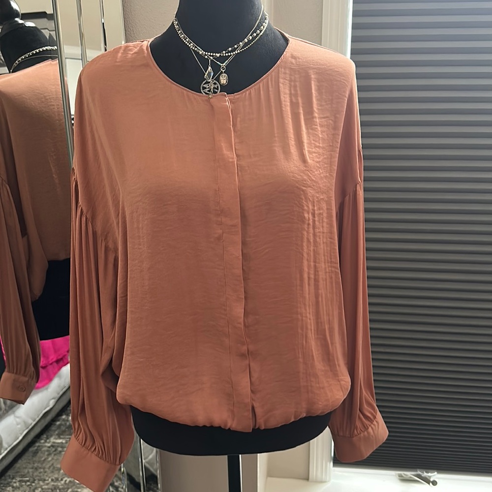 Women’s blouse size M.